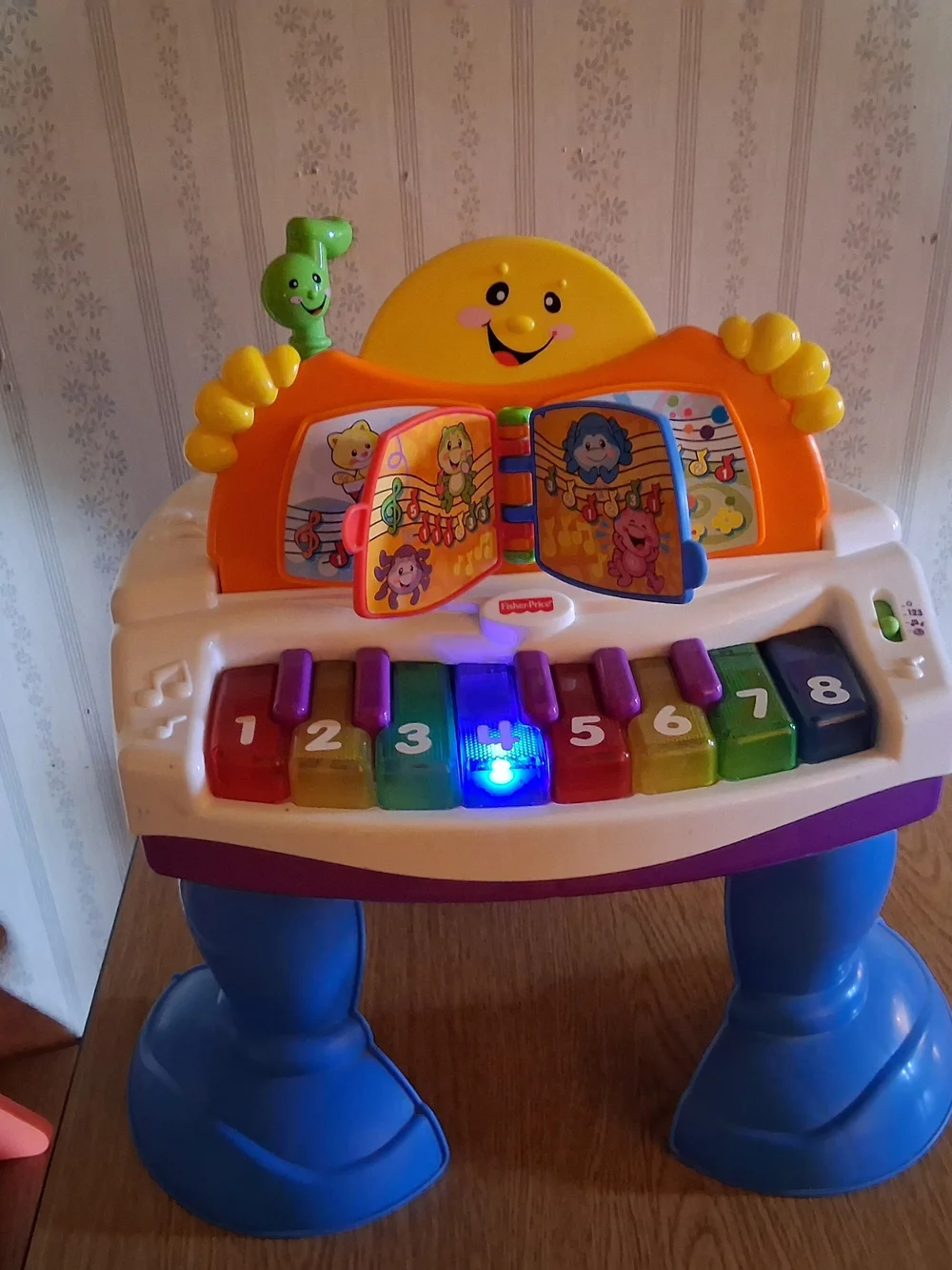 Fisher-Price Bright Rainbow Piano Playstand with Musical Book